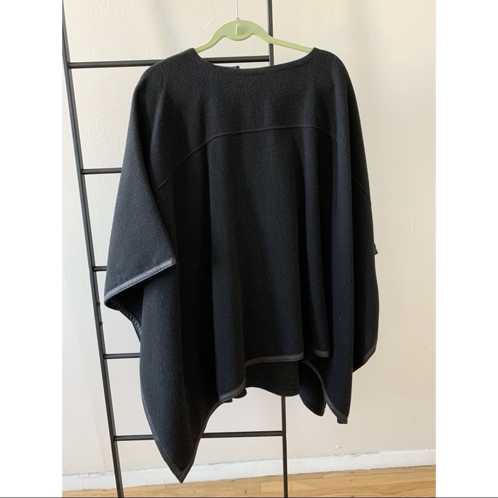 Gorgeous mid-weight wool poncho with lambskin leather trim.